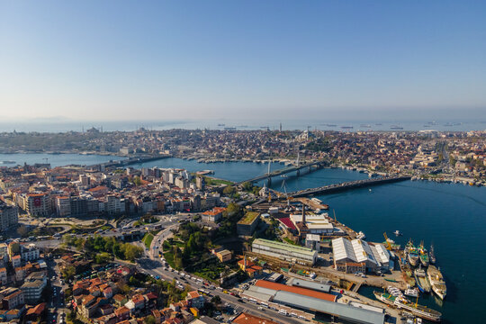 Aerial view of the Golden Horn waterway with Ataturk Bridge and Galata Bridge connecting the European Side of Istanbul downtown, Beyoglu district, Turkey.