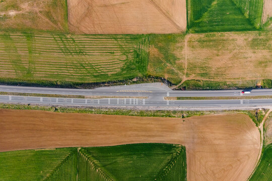 Aerial view of a truck driving on the highway along Lake Tuz in Central Anatolia region, Ankara, Turkey.