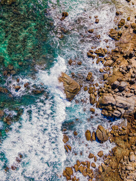 Aerial view of waves breaking along the coastline on the rocks, Westpunt Beach, Aruba.