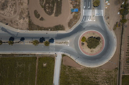 Aerial view of a roundabout close to an agricultural fields, Alboraia, Valencia, Spain.