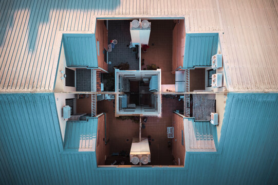 Aerial view of a modern symmetrical building in a residential city district, Camins al Grau, Valencia, Spain. - Powered by Adobe