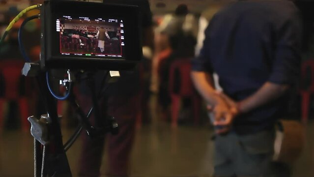 Close up view of film shooting Camera Screen TV
Filmmaking scenes
Blur Film Scene shot on the set with tv camera foreground
semi dark filming set in pavilion view via camera screen preview.