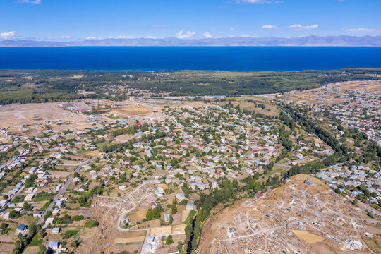 Aerial view of Nerkin Getashen village and Sevan lake on sunny summer day. Gegharkunik Province, Armenia.