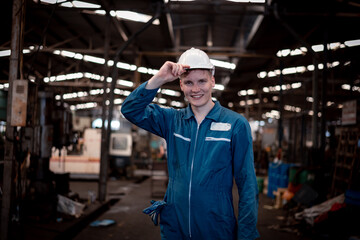 Portrait engineer worker industry wearing safety uniform pose standing at factory workplace with...