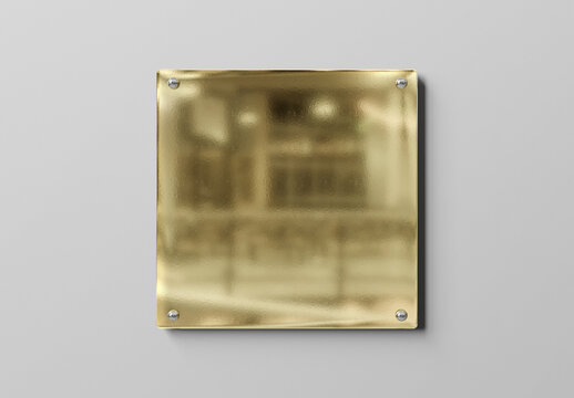 Gold glass sign plate on white wall Mockup. Business plate 3D rendering