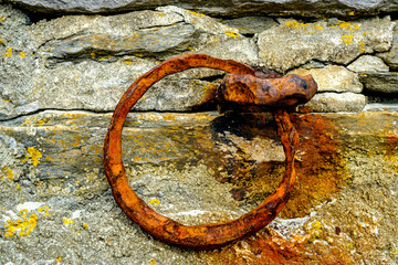 An Old Rusting Fishing Boat Mooring Ring Fixed In The Natural Rock Face
