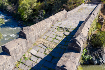 Sanahin Bridge on sunny summer day. Alaverdi, Lori Province, Armenia.