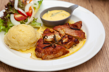 Pork sirloin steak with mash potato and bearnaise sauce