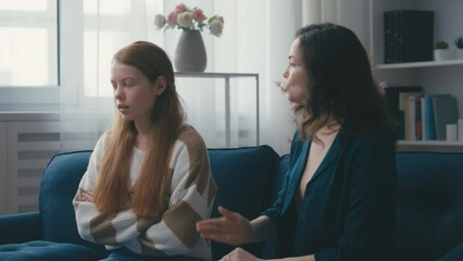 Displeased mother lecturing teenage daughter, generation gap, rebellious phase