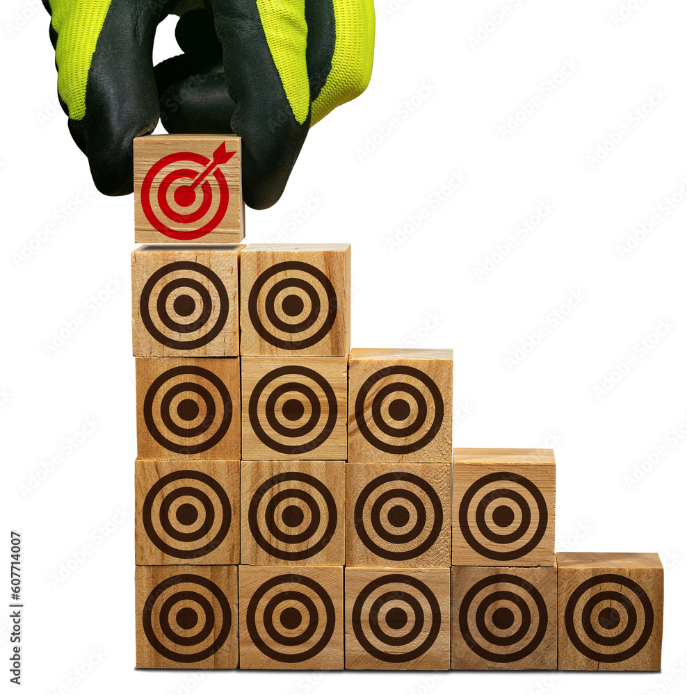 Poster gloved hand arranging wood blocks with many empty brown targets and one red one with an arrow reachi