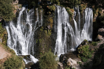 Long exposure shot of Shaki waterfall on sunny summer day. Syunik Province, Armenia.