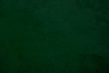 Green board. Dark green wall backdrop. Education concepts.	
