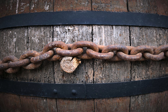 Close-up of an old wooden barrel with a cork for making wine.
