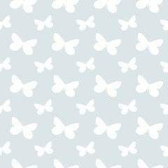 Seamless pattern with butterflies. White butterflies on a light blue background. Hand drawn monochrome illustration.