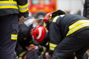 Car Crash Traffic Accident. Firefighters Rescue Injured Trapped Victims. Firemen give First Aid to...