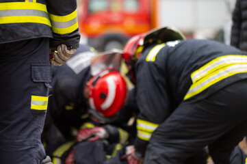 Car Crash Traffic Accident. Firefighters Rescue Injured Trapped Victims. Firemen give First Aid to passengers. High quality photography.