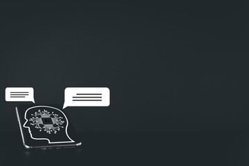 Artificial Intelligence icon on screen of smartphone with chat bubble over white black ground use for Artificial Intelligence (AI),machine learning,technology concept.