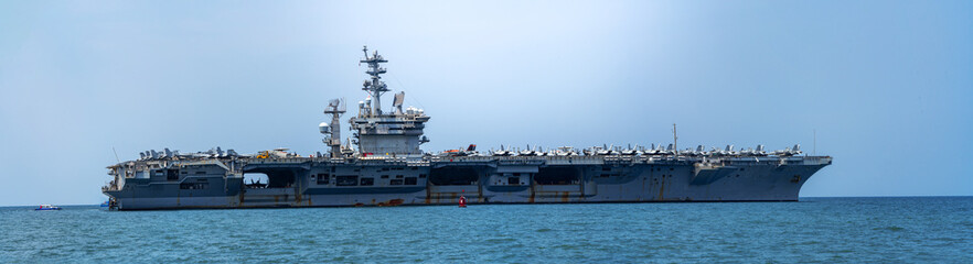 Nuclear WarShip, Military navy ship carrier full loading fighter jet aircraft for prepare troops. forwarder mast. Side view of Navy warship. © Yellow Boat