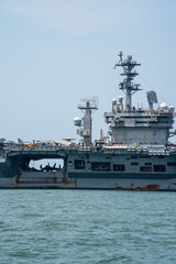 Nuclear War Ship, Military navy ship carrier full loading fighter jet aircraft for prepare troops. forwarder mast. Side view of War Ship.