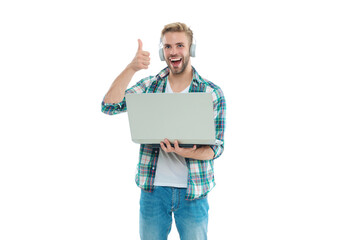 millennial man blogger in studio, thumb up. photo of millennial man blogger with laptop.