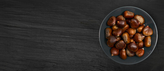 Chestnuts on Black Background, Edible Sweet Chestnut Pile, Autumn and Christmas Veggie Food