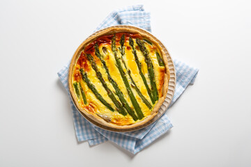 Top view of vegetables asparagus quiche on light surface