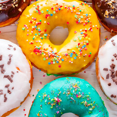 colorful fresh donuts on a white background