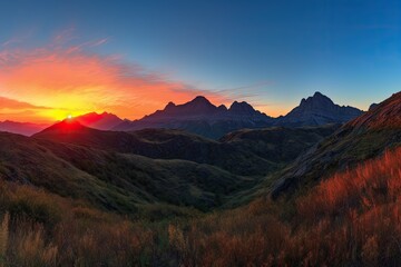 majestic mountain range with fiery sunset in the background and clear blue skies, created with generative ai