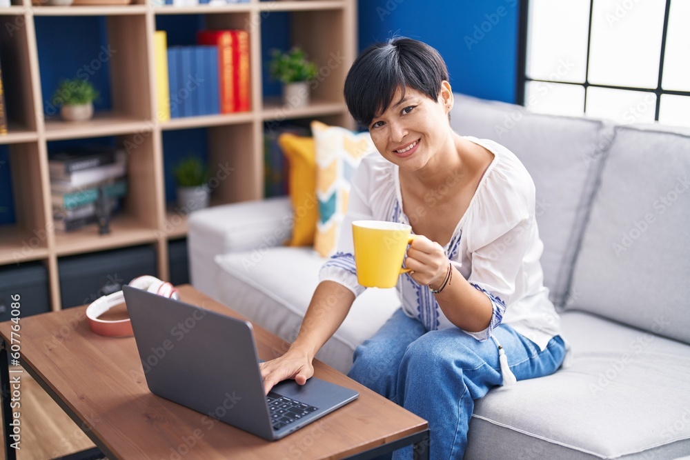 Sticker middle age chinese woman using laptop drinking coffee at home