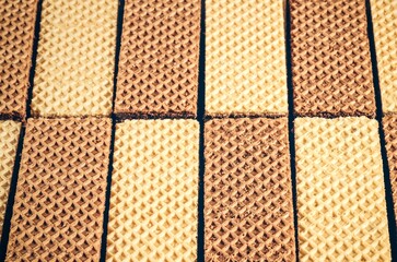Background from cocoa wafers. Sweet mix of light and dark wafers. - 607770237