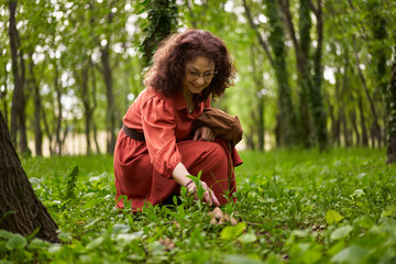 Candid of a mature curly hair redhead woman
