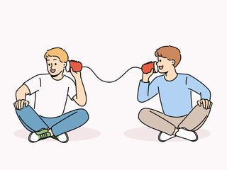 Smiling boys talk on tin can phone. Happy children have fun speak on handmade cups telephone. Childhood. Vector illustration. 