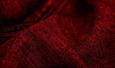 red jeans with a visible interesting texture. background