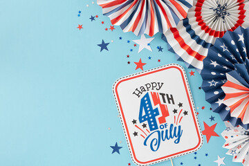 Obraz premium Idea for a Fourth of July party. Top view flat lay of paper party props in national colors, star-shaped confetti on light blue background with empty space for text or promotion