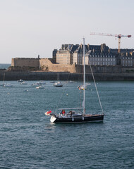 Yacht and St Malo walled town and harbour