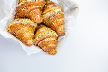 Croissants in Basket on white table