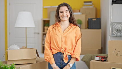 Young beautiful hispanic woman smiling confident standing at new home