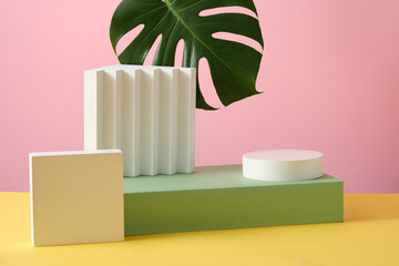 Rectangle podium with a round podium stacked on and a square podium beside. Minimal scene with...