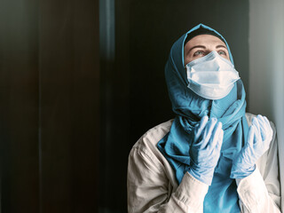 a doctor, a Muslim woman in a hijab and a protective medical bandage, was tired after taking a large number of patients as a result of the outbreak of the coronavirus