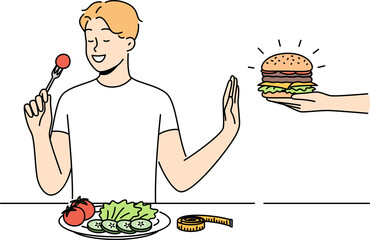 Smiling man eat salad refuse from burger