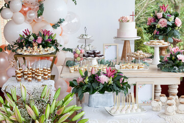 Fototapeta na wymiar Table With Sweets, Desserts, And Cake; Decorated Table For The Reception