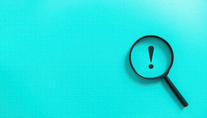 Magnifier magnifying exclamation mark on blue background. Alert and caution concept.