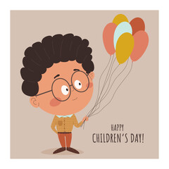 A cartoon boy with balloons and the words happy children's day