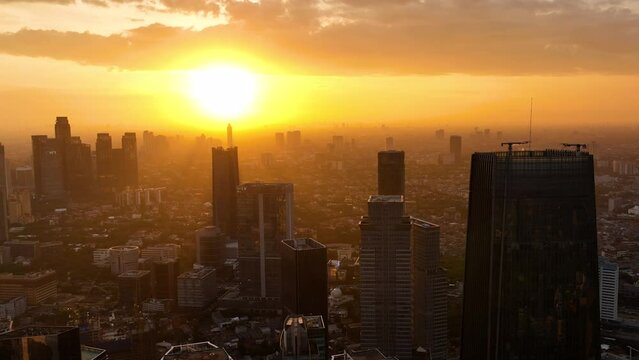 Aerial view of sunset over Jakarta. Cityscape with skyscrapers. Indonesia.