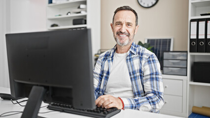Middle age man business worker using computer working at office