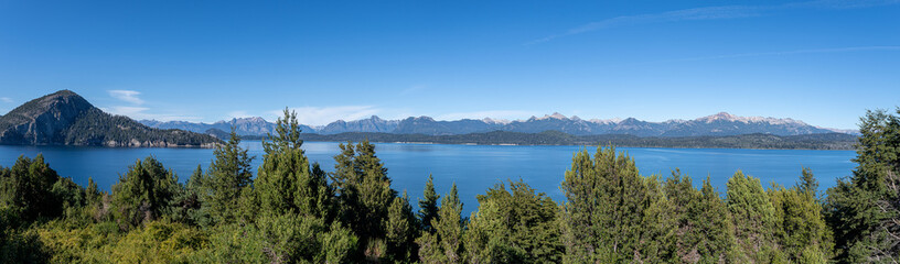 Fototapeta na wymiar Journey to Nahuel Huapi, where the stillness of the lake meets the rugged beauty of the Andes, creating a paradise for adventurers
