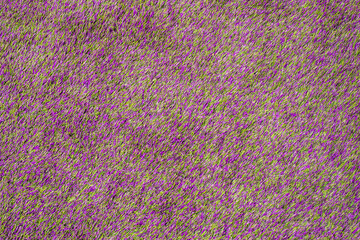 Artificial plastic textured floor covering green and violet colors close-up