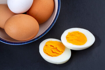 Boiled egg served on a black background