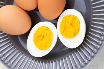 Boiled egg served on a black background