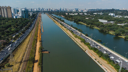 Traffic on the Marginal Pinheiros highway in the city of São Paulo captured on a sunny day in Brazil.